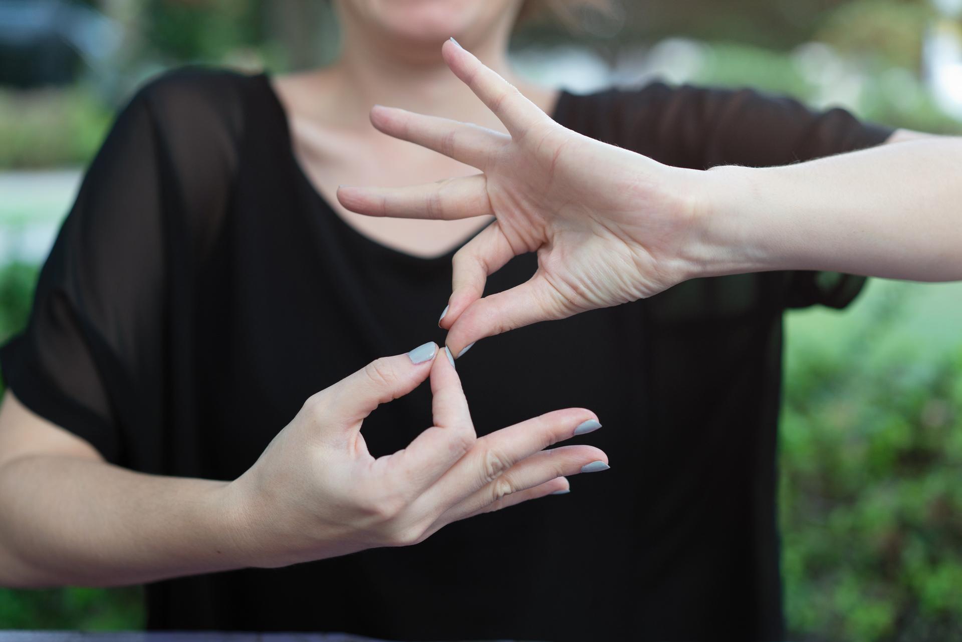 Deaf woman using sign language